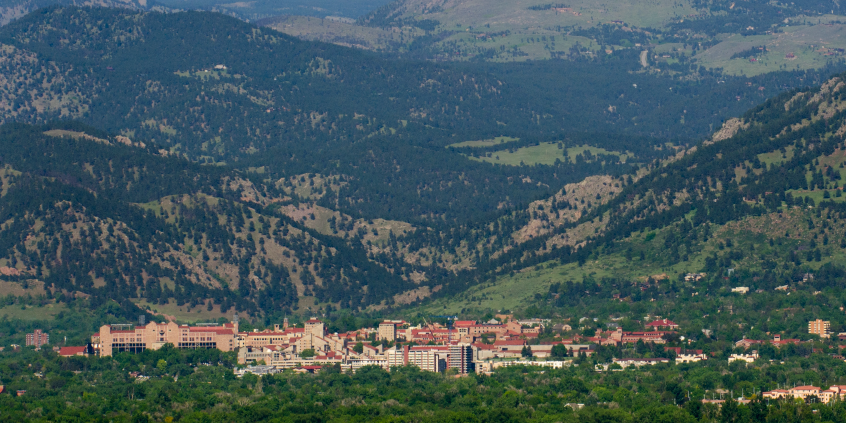 Cu Boulder campus surrounded by the flatiron mountains